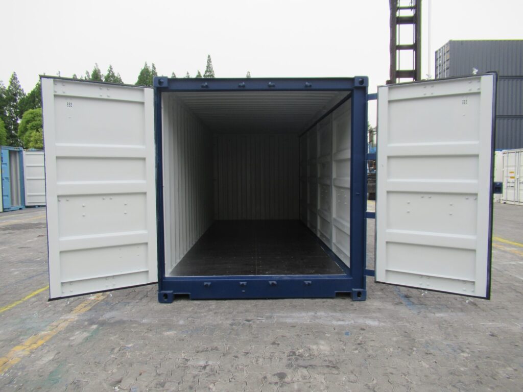 20’ shipping container with full side access - open side container with two sets of bifold doors along one side for full side access, with double swing doors on one end (end).