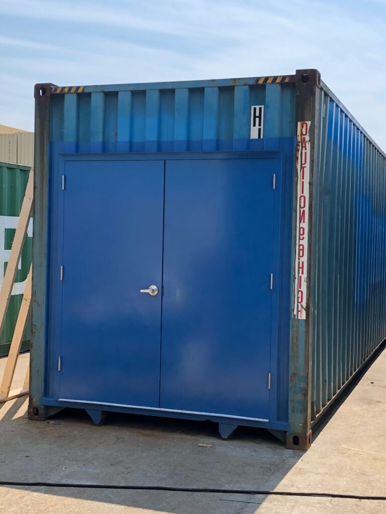 Freight container modified to include 6068 personnel doors on the front of the of the container (exterior view)