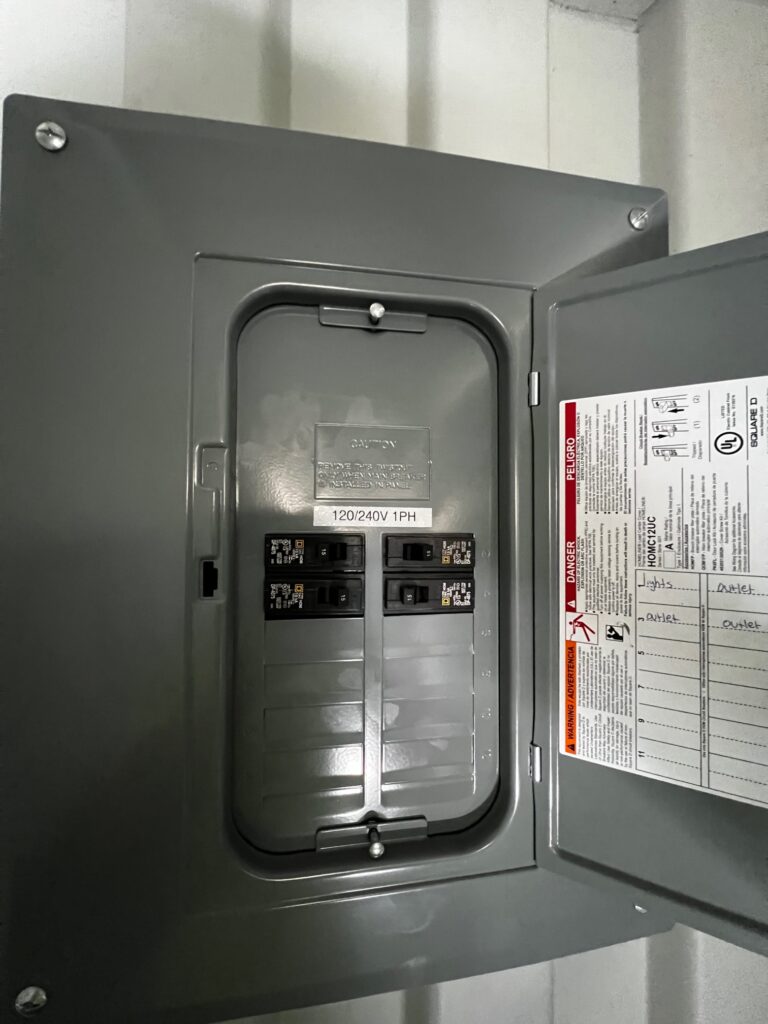 Electric utility panel custom installed on 40' cargo shipping container