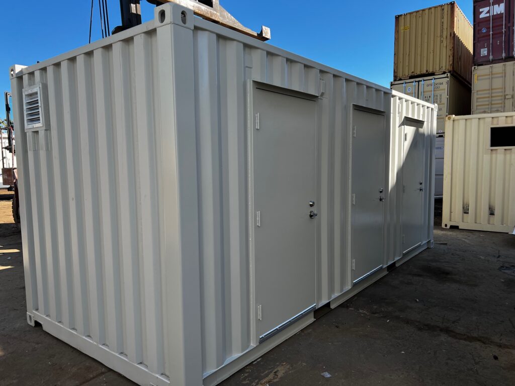 20 foot modified conex container with 3068 personnel doors and interior partition walls to create three separate compartments