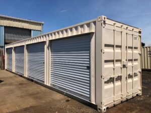 40' container modified to include several roll up doors and interior partition walls to form separate compartments