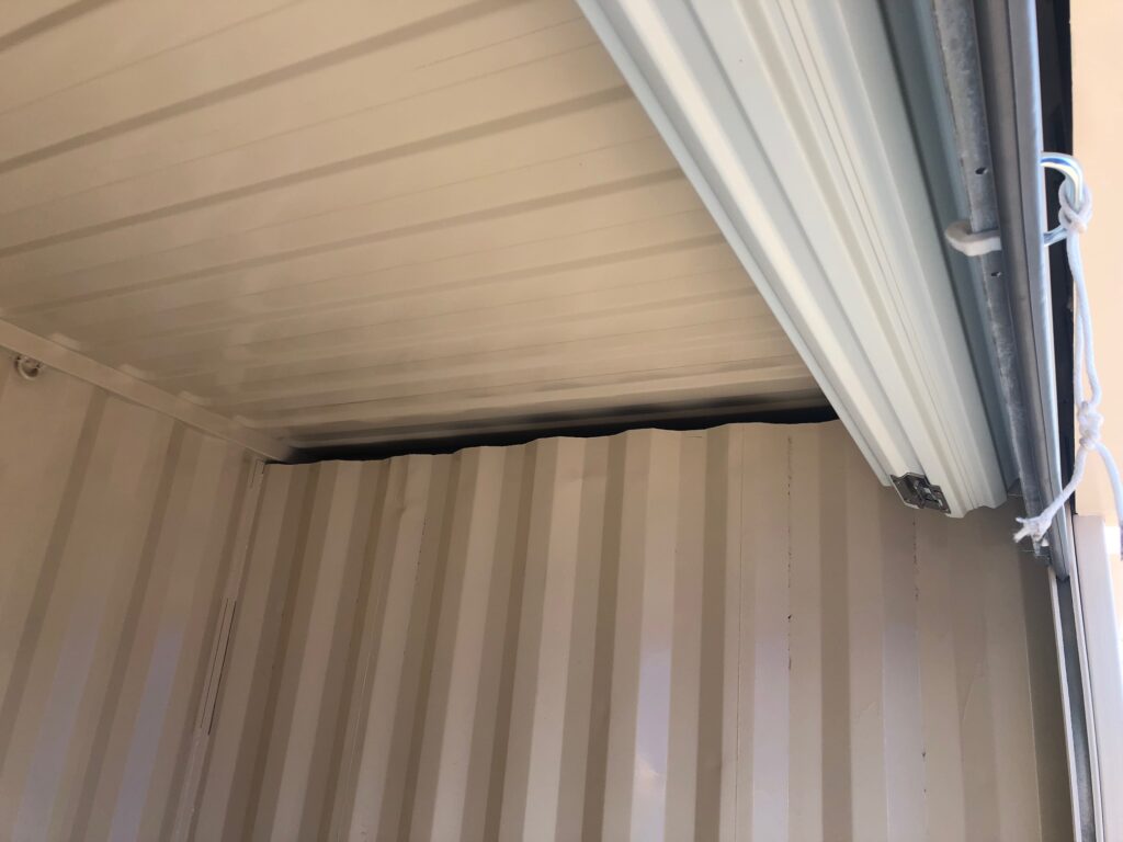 Roll up door installed on shipping container (close up)