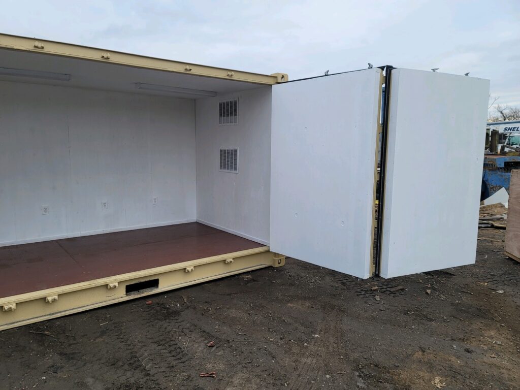 Custom 20 foot full-side-access conex container with an HVAC unit, interior framed insulated plywood walls, side bifold doors, and fully operational end doors (exterior-open)