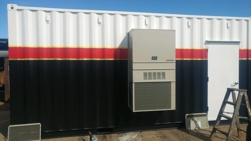 Customized 40' shipping container with HVAC system installed on the side, shipped securely inside the container for customer installation on site. Container also has 3068 personnel doors, lighting circuit breaker panel and other electrical components (outside)
