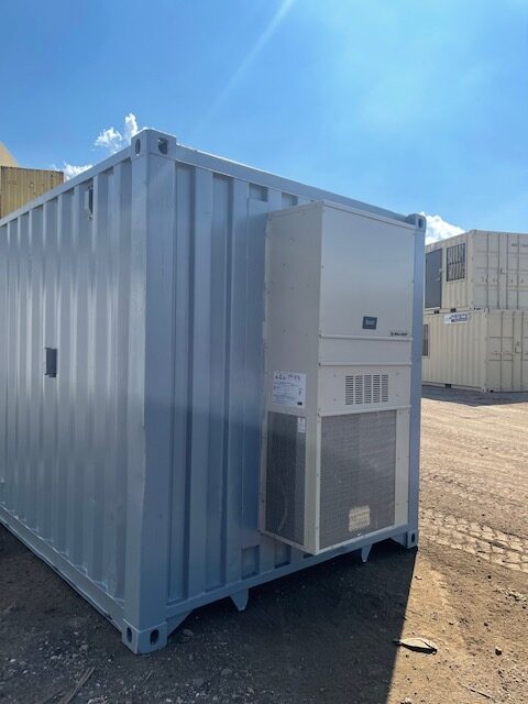 40 foot shipping container modified to include HVAC, 3068 door, interior walls framed and insulated and covered with plywood, with lighting & outlets (exterior-front)