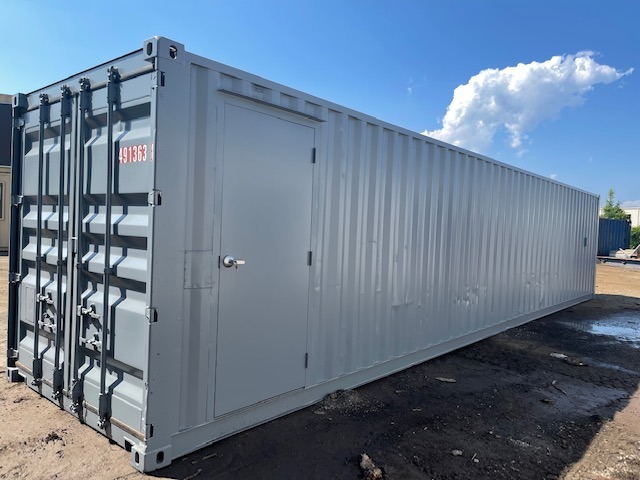 40 foot shipping container modified to include HVAC, 3068 door, interior walls framed and insulated and covered with plywood, with lighting & outlets (exterior-back)
