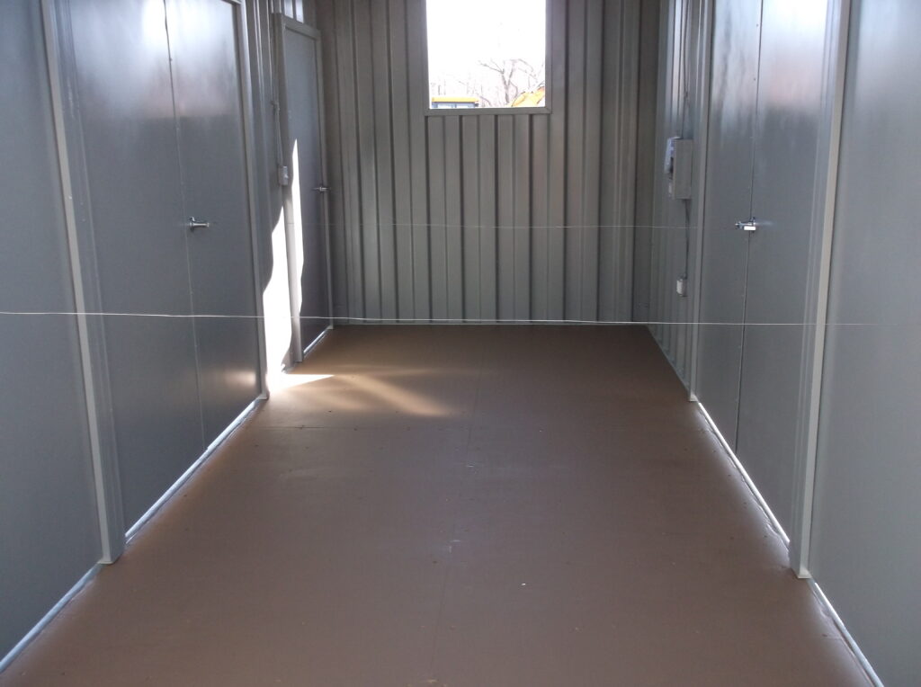 Seabox Container with various cut outs and personnel doors installed (interior looking across)